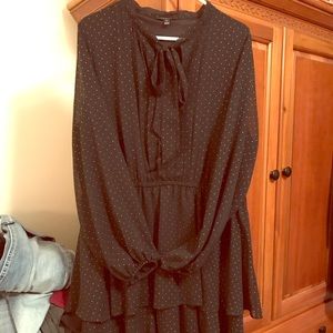 Women’s black tiered dress with gold accents